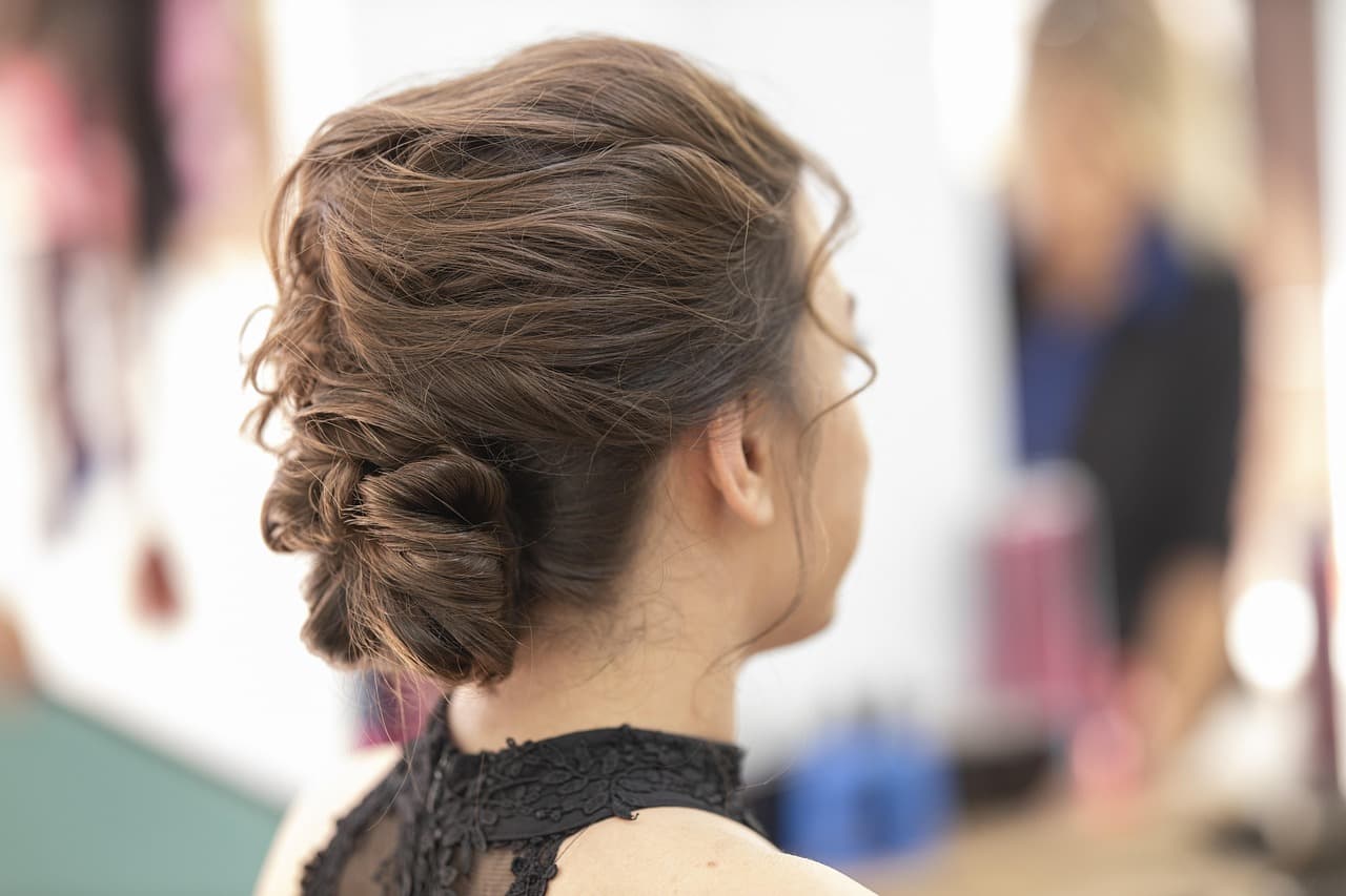 A soft, textured updo finished at the back of the head